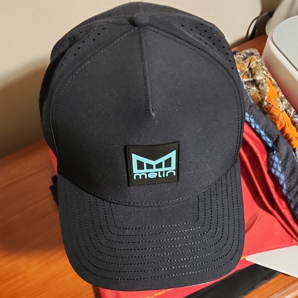 Melin Odyssey Aqua Splash. XL 69cm BNWT Melin Hat Bag Included.